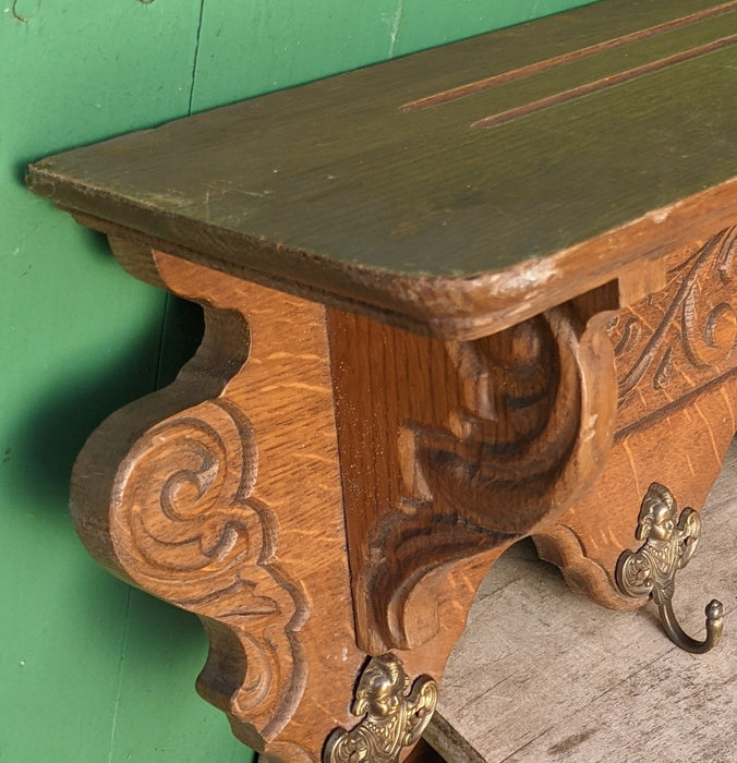 LONG FOLIATE DESIGN OAK WALL SHELF WITH BRASS ANGEL HOOKS