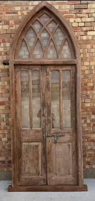 PAIR OF WOOD DOORS IN GOTHIC ARCH TRANSOM FRAME