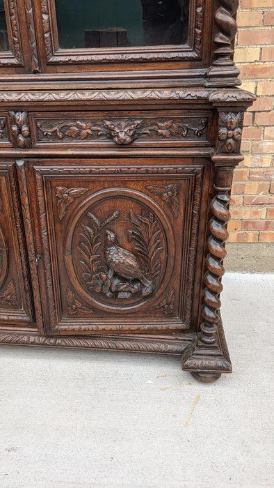 LARGE CARVED OAK BOOKCASE WITH GREENMAN AND MYTHOLOGICAL FIGURES