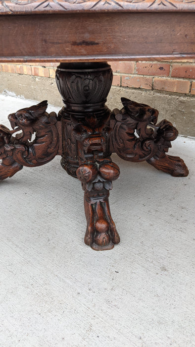 OAK COFFEE TABLE WITH CARVED LIONS