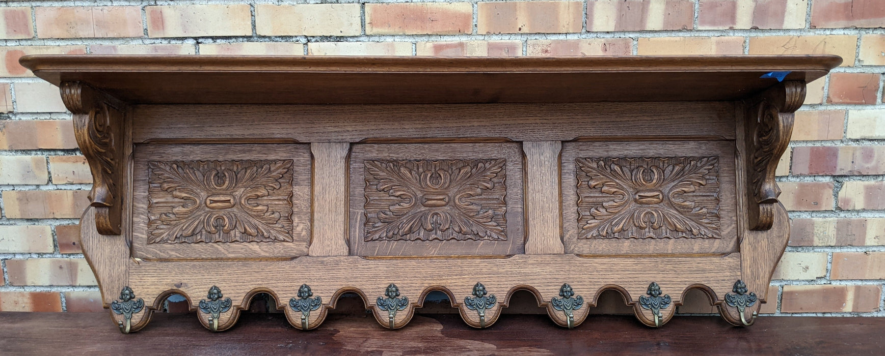 LARGE OAK WALL SHELF WITH 3 FLORET CARVED PANEL WITH HOOKS