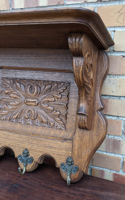 LARGE OAK WALL SHELF WITH 3 FLORET CARVED PANEL WITH HOOKS
