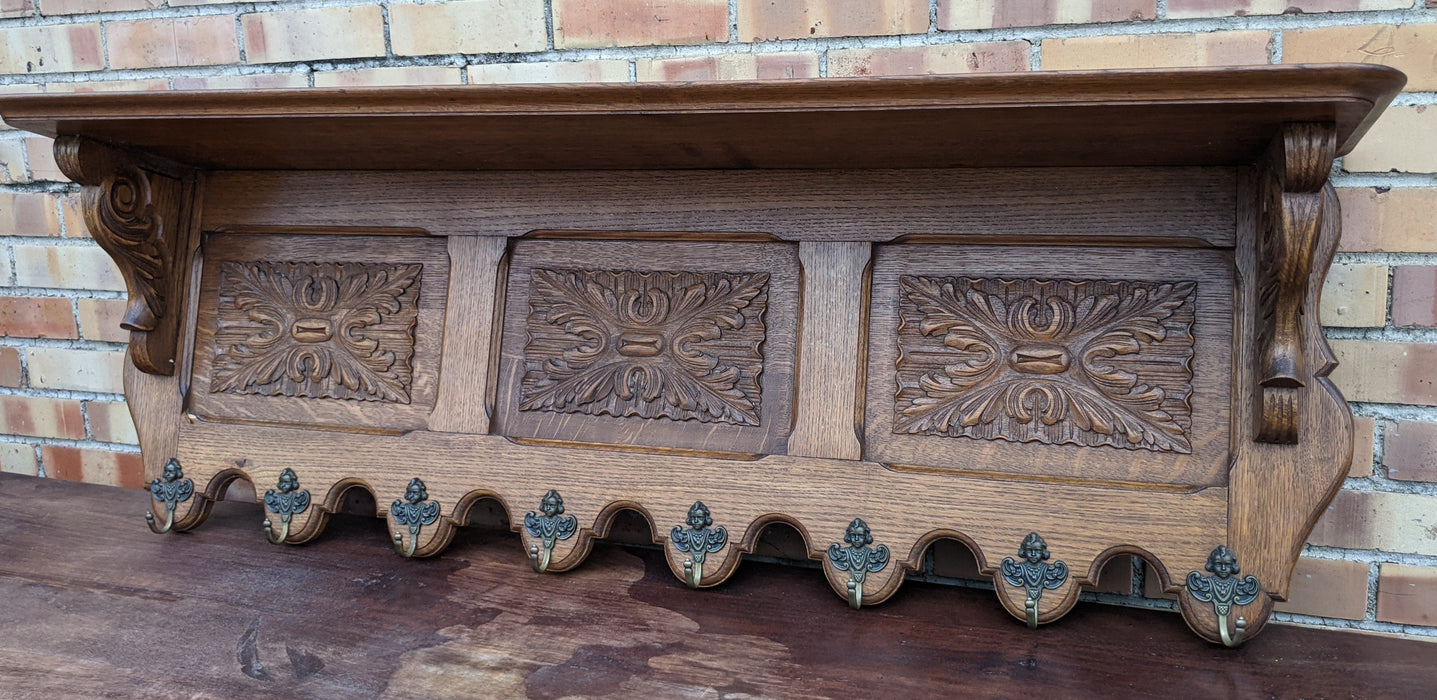 LARGE OAK WALL SHELF WITH 3 FLORET CARVED PANEL WITH HOOKS