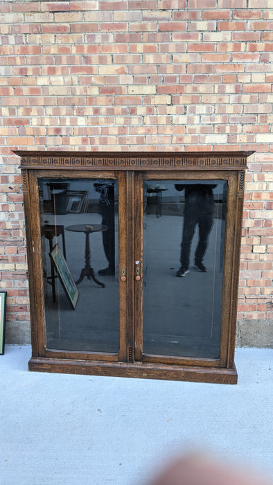 QUATER SAWN OAK BOOKCASE WITH BEVELED GLASS DOORS AND NO SHELVES-AS FOUND
