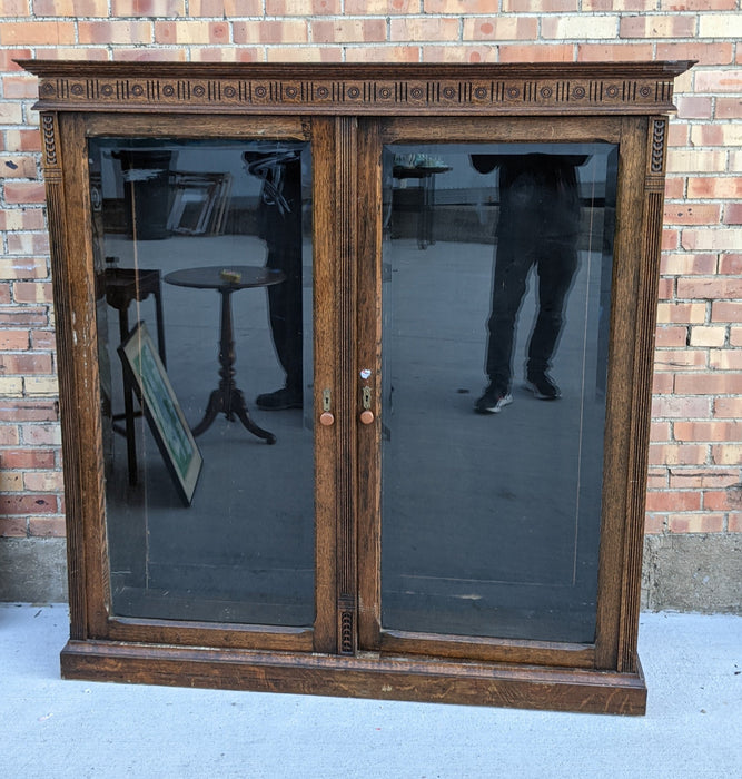 QUATER SAWN OAK BOOKCASE WITH BEVELED GLASS DOORS AND NO SHELVES-AS FOUND