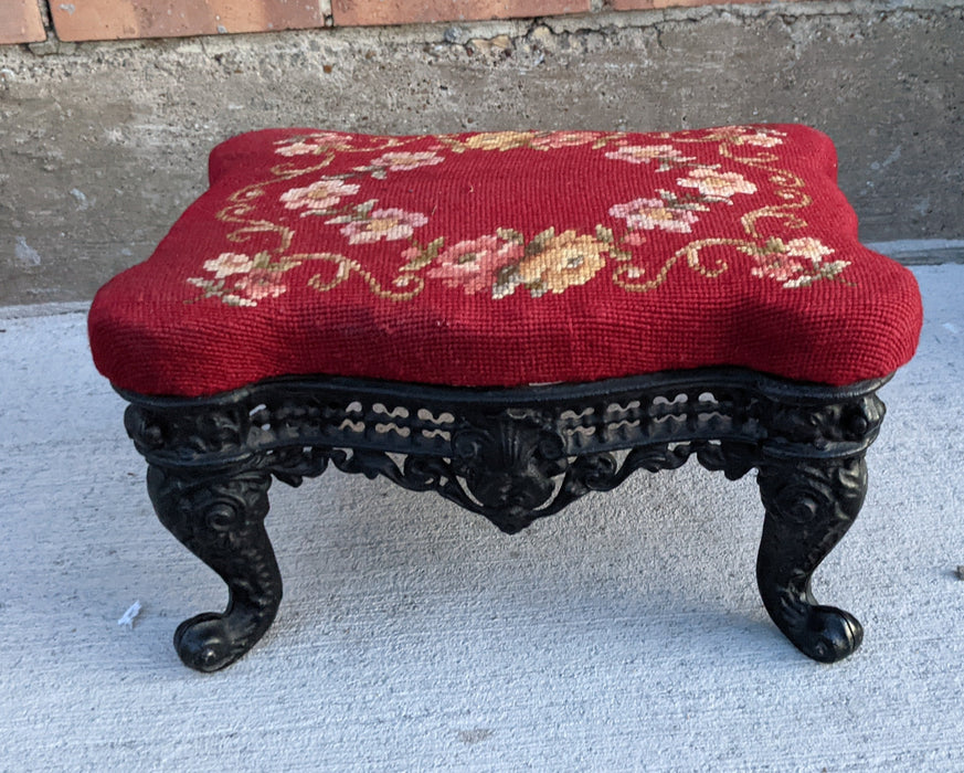 SMALL CAST IRON FOOTSTOOL WITH NEEDLEPOINT CUSHION