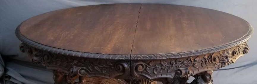 141", ALMOST 12 FEET LONG HIGHLY CARVED OVAL TABLE WITH WINGED ANGELS-BY RJ HORNER