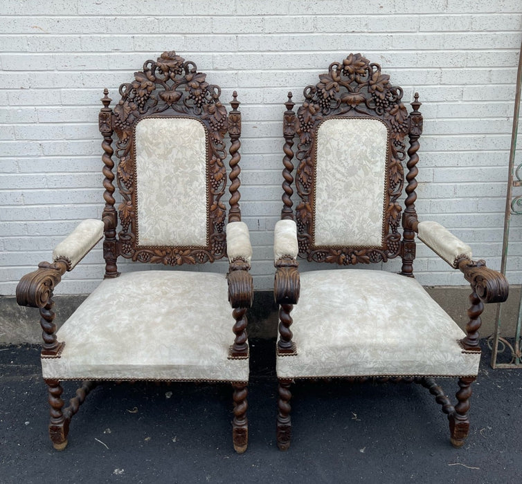 PAIR OF BARLEY TWIST THRONE CHAIRS WITH FEATHER CARVED ARMS AND GRAPE CRESTS