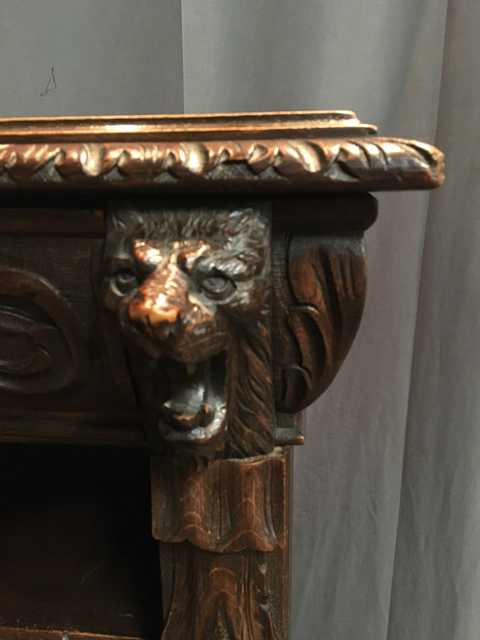 FRENCH OAK CARVED GRIFFIN HEAD BOOKCASE