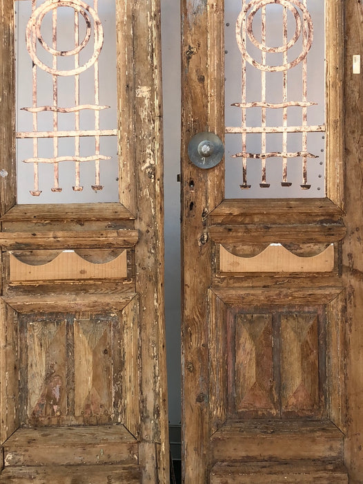 PAIR OF EGYPTIAN PRIMITIVE DOORS WITH IRON INSETS