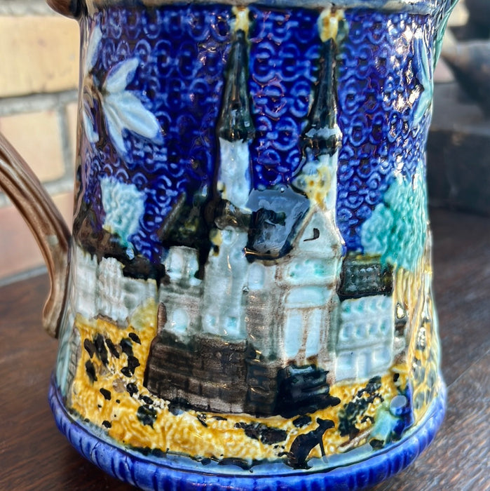 BLUE MAJOLICA PITCHER WITH CHURCH