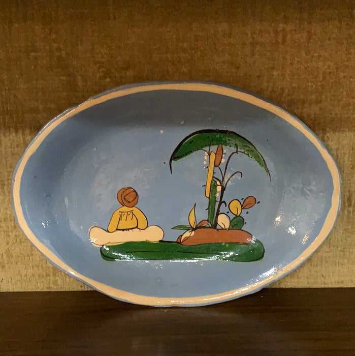 BLUE MEXICAN POTTERY PLATE WITH PERSON AND CACTI