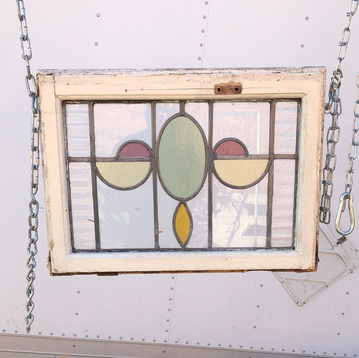 STAINED  GLASS WINDOW WITH GREEN OVALS AND YELLOW HALF OVALS