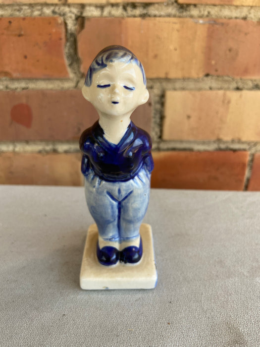 DELFT FIGURE OF BOY WITH HANDS IN POCKET