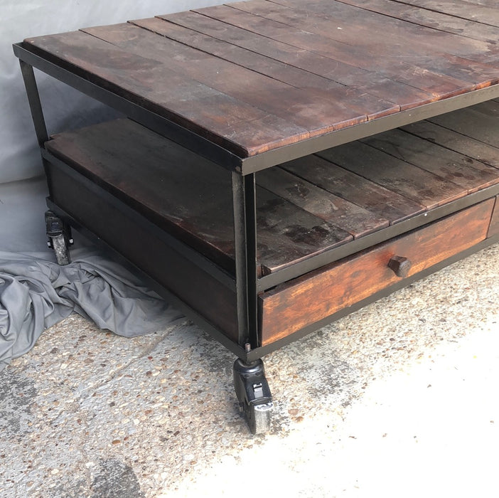 IRON AND WOOD COFFEE TABLE WITH DRAWERS ON CASTERS