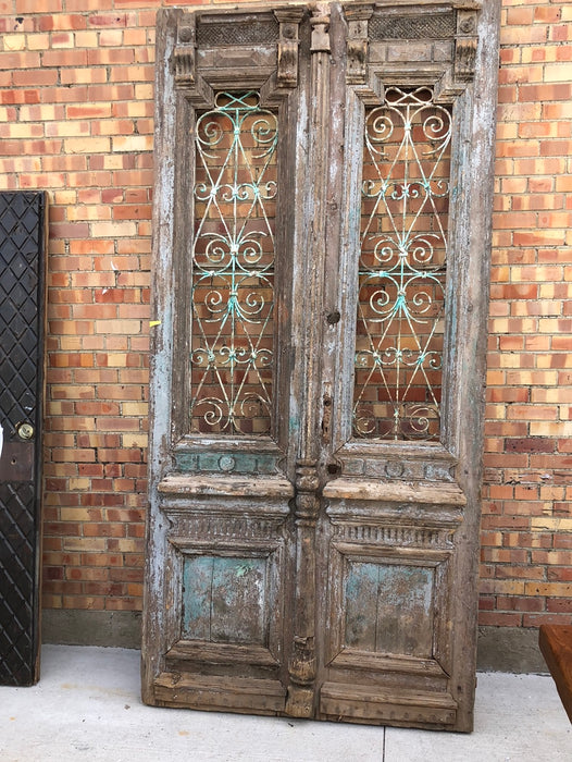 PAIR OF TALL EGYPTIAN DOORS WITH WROUGHT IRON DETAILS