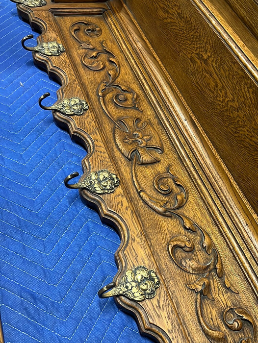 FOLIATE CARVED OAK WALL SHELF WITH HOOKS AND FLEUR DE LIS