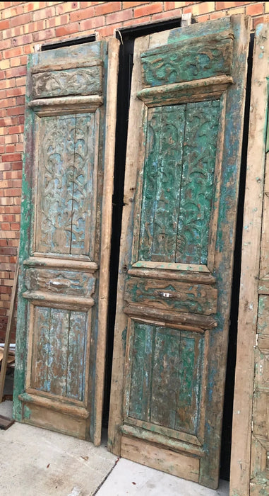 PAIR OF PRIMITIVE EGYPTIAN DISTRESSED GREEN WOODEN DOORS WITH INCISED CARVING