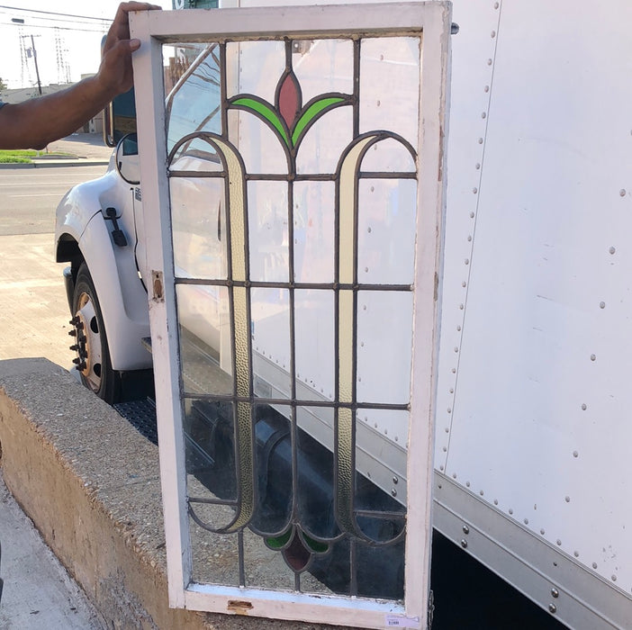 TALL STAINED GLASS CASEMENT WINDOW WITH RED BUD AND MULTI CLORED LEAVES