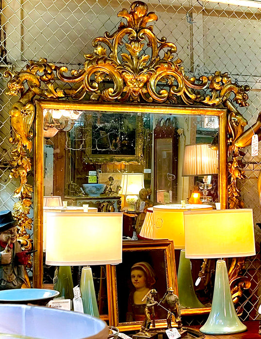 LARGE 19TH CENTURY GILT GESSO AND WOOD MIRROR WITH GRIFFINS AND MASK PEDIMENT