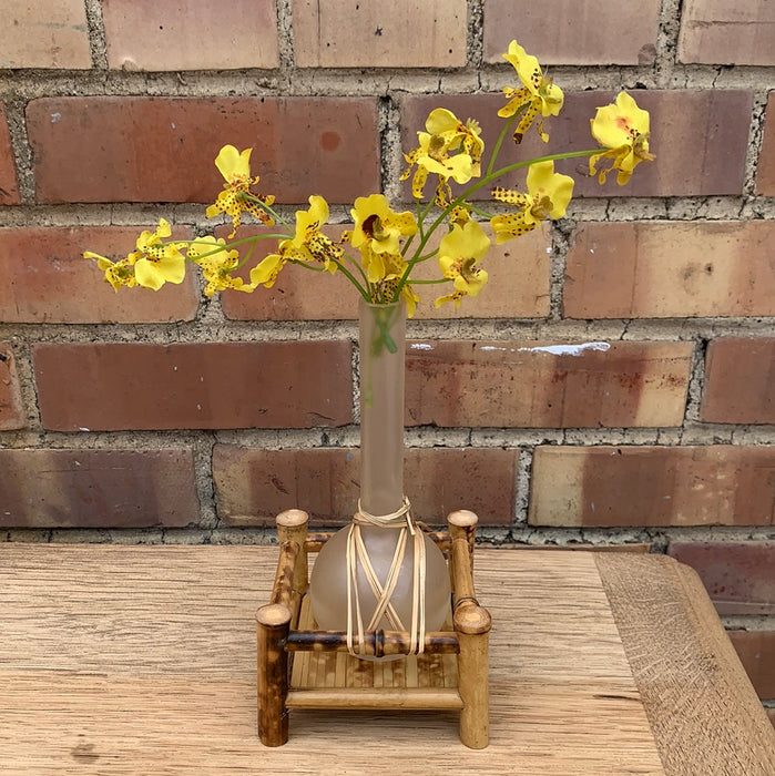 SMALL FAUX YELLOW FLORAL IN GLASS VASE ON BAMBOO BASE