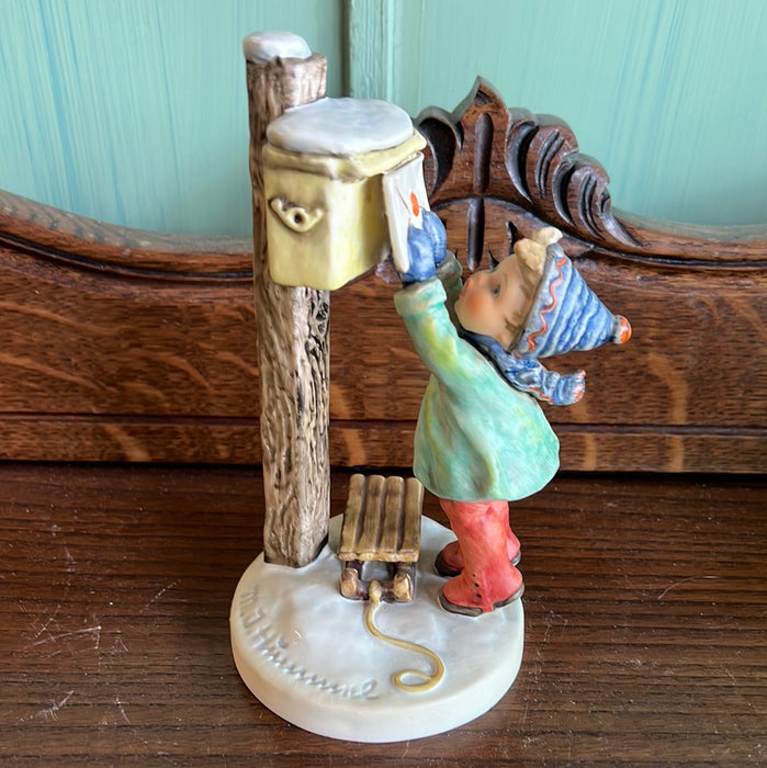 HUMMEL OF CHILD MAILING A LETTER