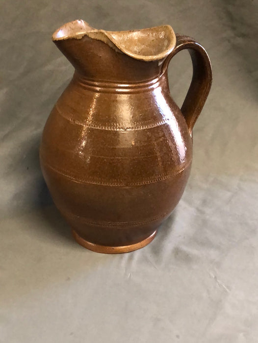 SMALL BROWN BULBOUS BASE HAND THROWN POTTERY PITCHER