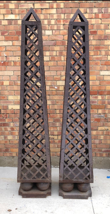 PAIR OF TALL METAL OBELISKS