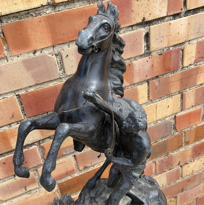 ANTIQUE SPELTER MAN WITH HORSE FIGURE