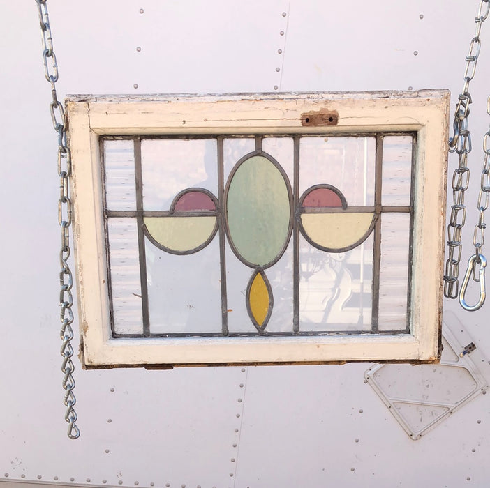 STAINED  GLASS WINDOW WITH GREEN OVALS AND YELLOW HALF OVALS