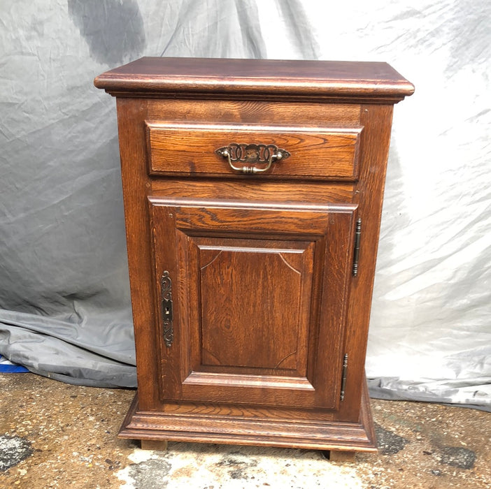 NARROW DARK OAK JAM CABINET WITH NOTCHED RETANGULAR PANEL