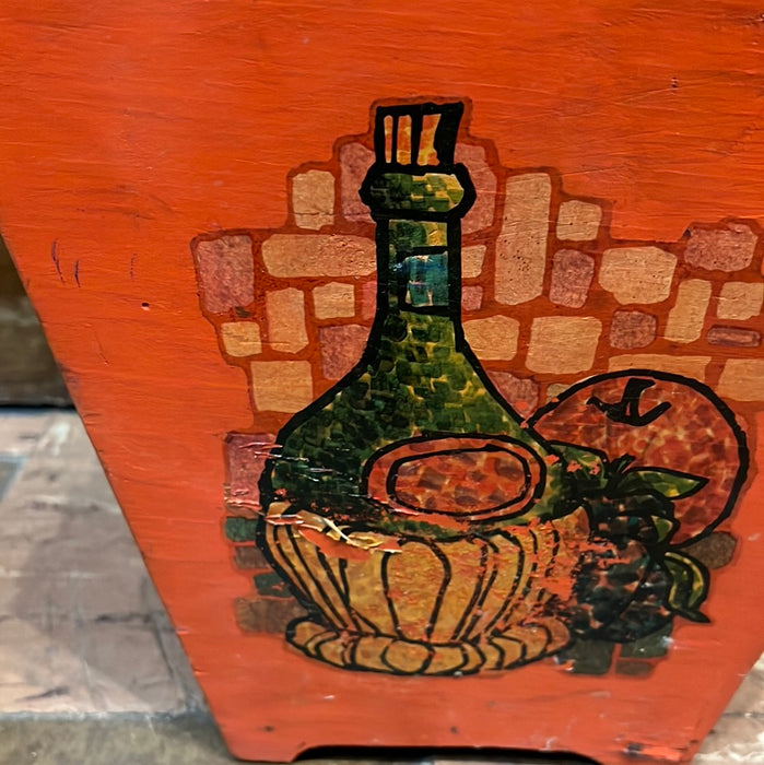 ORANGE PAINTED WOOD TRASH CAN WITH OLD WINE BOTTLE