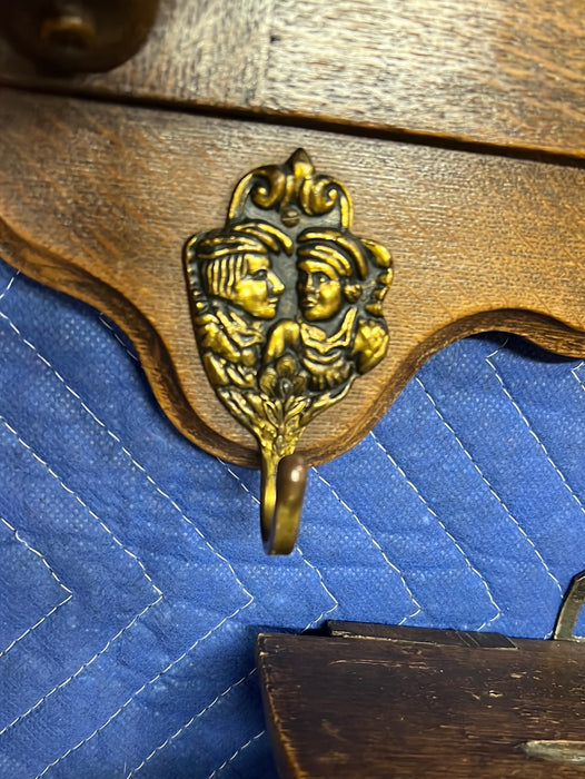 OAK CROSS AND FIGURAL CARVING WALL SHELF WITH HOOKS