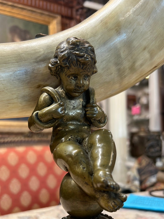 BRONZE FIGURAL PUTTI EPERGNE WITH HORN