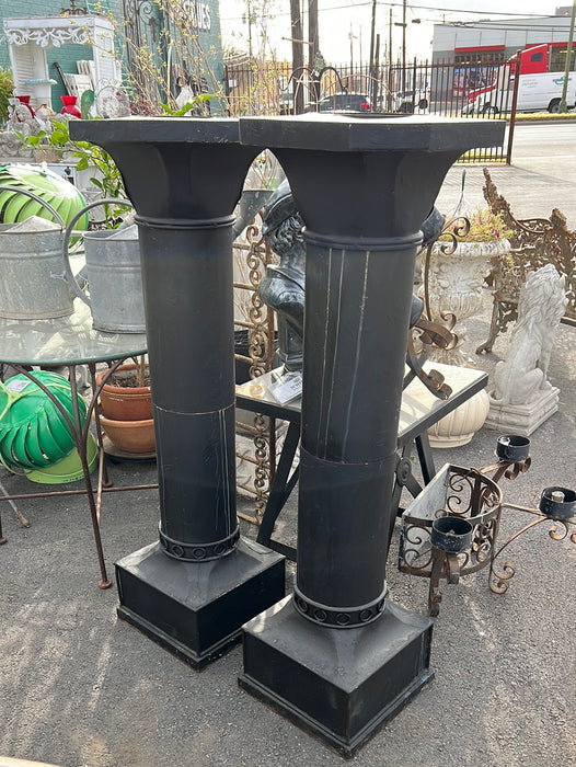 PAIR OF BLACK METAL COLUMNS WITH PLANTER TOPS