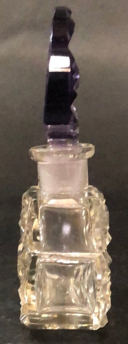 CLEAR PERFUME BOTTLE WITH PURPLE TOP