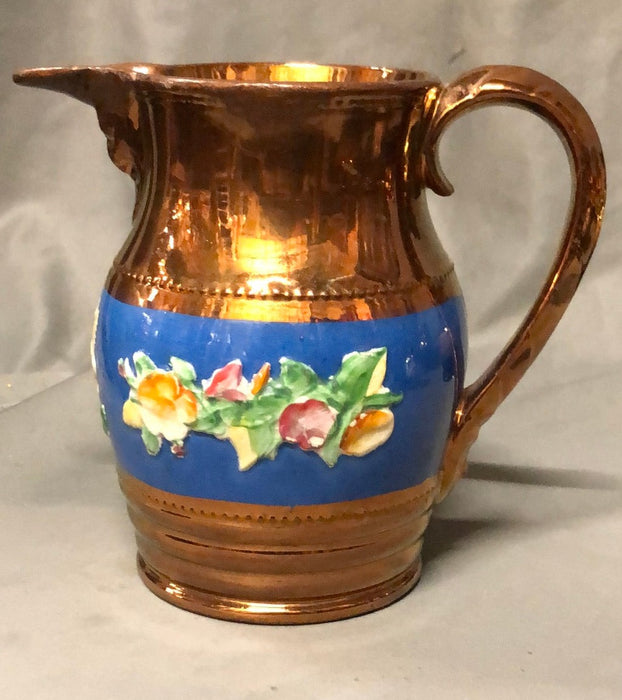 MEDIUM COPPER LUSTER PITCHER WITH BLUE BAND AND FLOWERS IN RELIEF