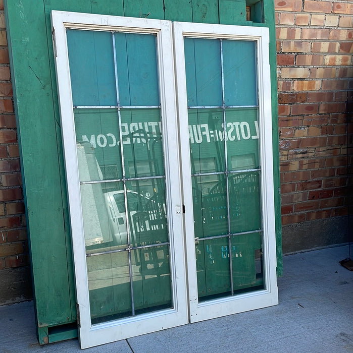 PAIR OF VERTICAL NARROW LEADED GLASS WINDOWS WITH RECTANGULAR PANES