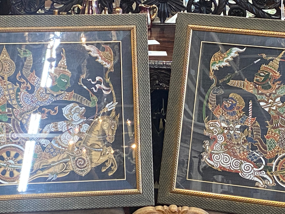 PAIR OF PAINTED CLOTH THAI WARRIORS IN BLUE LINEN FRAME WITH GOLD TRIM