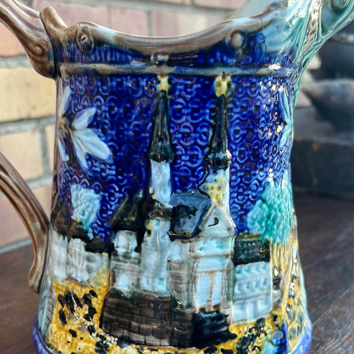 BLUE MAJOLICA PITCHER WITH CHURCH