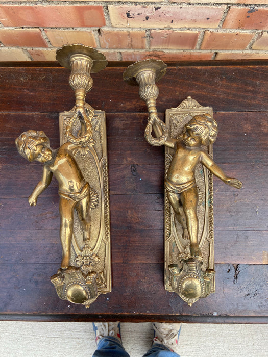 PAIR OF FIGURAL PUTTI BRASS CANDLE SCONCES