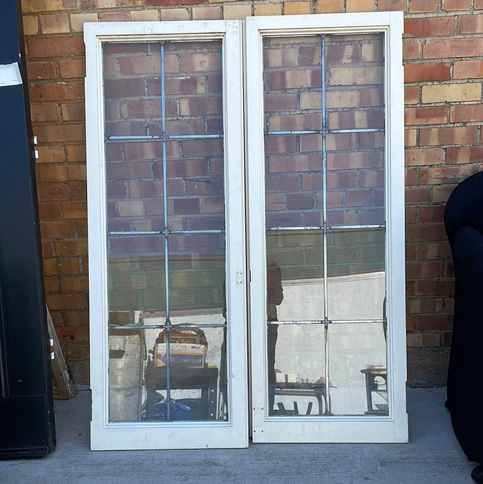 PAIR OF VERTICAL NARROW LEADED GLASS WINDOWS WITH RECTANGULAR PANES