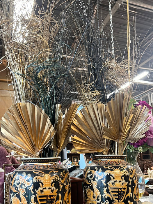 PAIR OF BLACK AND GOLD VASES WITH GLITTERY FANS AND STICKS ARRANGEMENTS