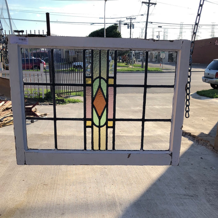 SMALL STAINED  GLASS WINDOW WITH YELLOW DIAMOND IN GREEN OVAL