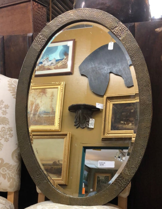EMBOSSED BRASS OVAL FRAME WITH BEVELLED MIRROR