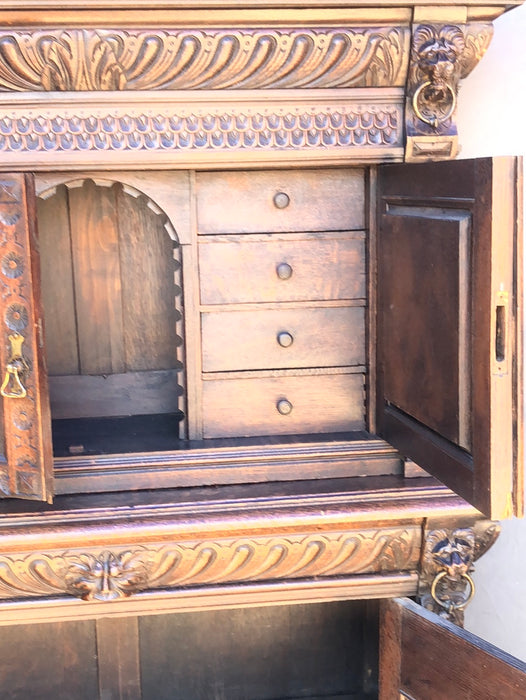 CARVED 2-PIECE OAK BRUEGHEL CABINET WITH FITTED INTERIOR