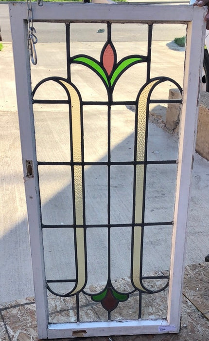 TALL STAINED GLASS CASEMENT WINDOW WITH RED BUD AND MULTI CLORED LEAVES