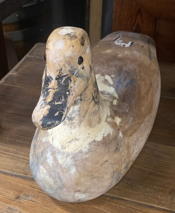 CARVED WOOD WITH BLACK AND WHITE DUCK WITH GLASS EYES