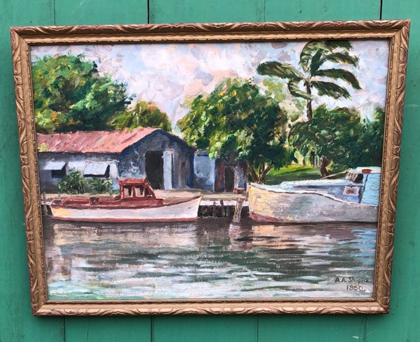 SMALL OIL PAINTING OF BOATS IN A TROPICAL SETTING