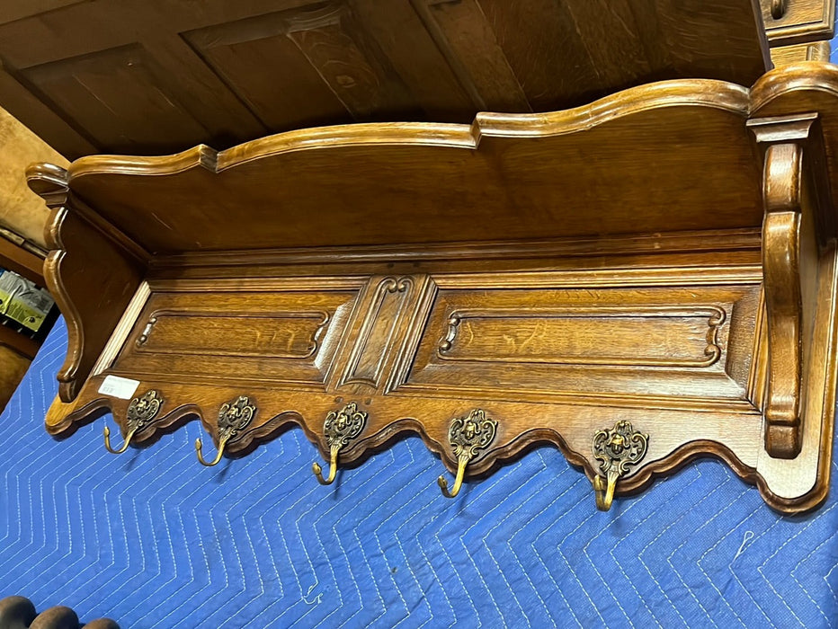 PANELED OAK WALL SHELF WITH GENTLEMAN ON HOOKS